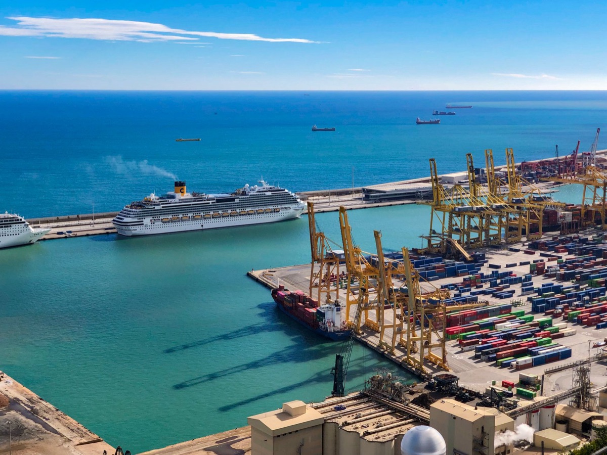 Port of Barcelona with cargo ships and loading cranes
