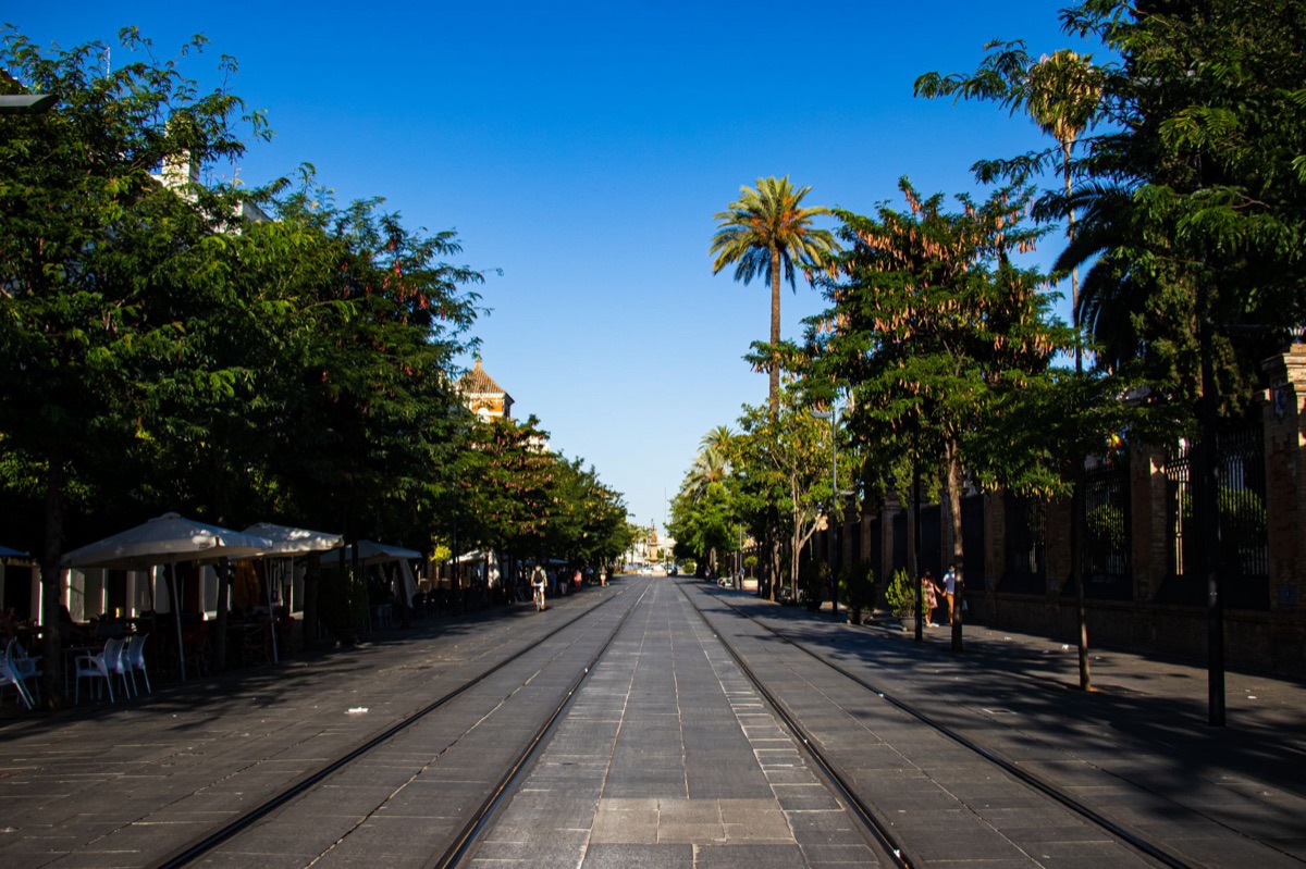 Seville street with immigrants and locals